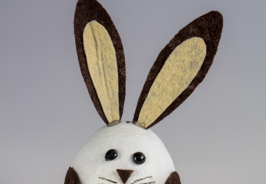Cute handmade Easter bunny craft made from white egg with brown 